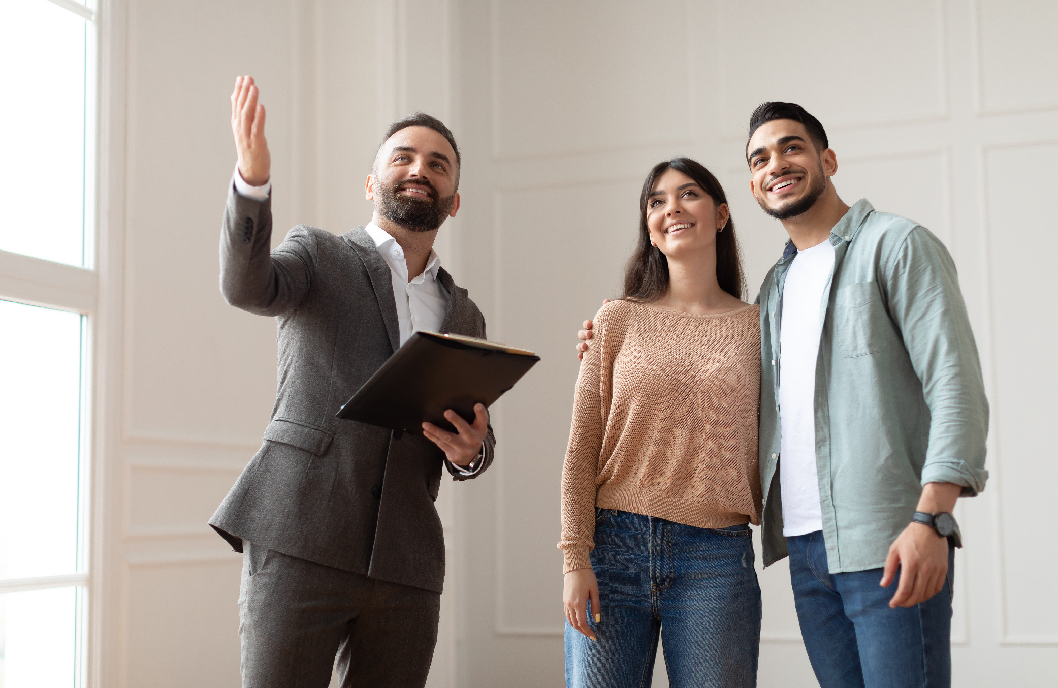 Real Estate Agent presenting the Compound to his clients using real estate tips for new agents